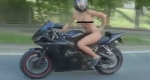 naked woman on motorbike